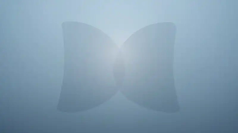Two translucent shapes overlap amidst a misty blue glow