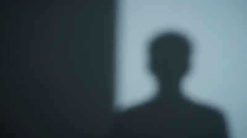 Two contrasting shadows, one sharp and one blurred, meet
