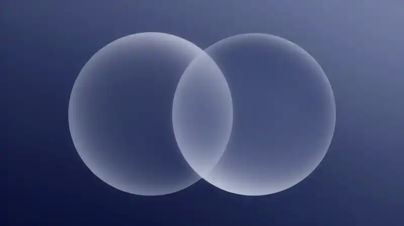 Two textured, translucent spheres overlap against a blue gradient