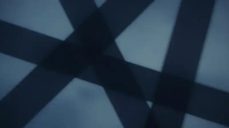 Abstract blue silhouettes overlap in a moody, indigo setting
