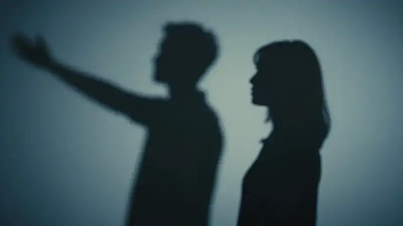 Two contrasting silhouettes face off against abstract blue shadows